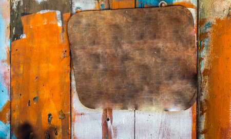 A closeup shot of abstract painting on rustic wooden planksの写真素材