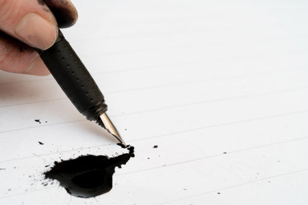 The calligraphy training. Fountain pen in ink-stained handsの写真素材