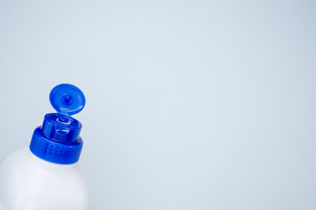 A closeup of a plastic bottle with a blue cap isolated on a white backgroundの写真素材