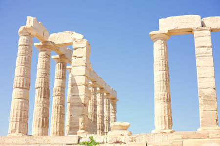 The ancient Greek temple of Poseidon on the background of the clear blue sky at Cape Sounion, Greeceの写真素材