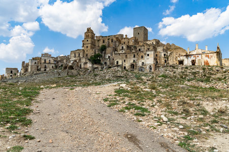 A path and buildings in Craco ghost town, Basilicata, Italyの写真素材