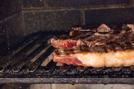 The process of making meat steak in the kitchenの写真素材