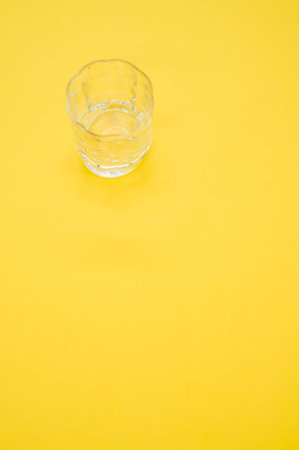 A closeup shot of an empty glass on a y surface - copy spaceの写真素材