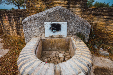 Stock photo of fountain with dry soil because of drought in the countryside.の写真素材