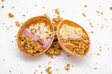 A closeup shot of vegan granola bowl with granola made from oats and chia seeds isolated on white backgroundの写真素材