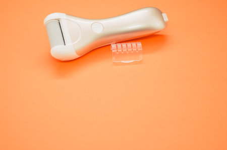 An electric roller file on an orange backgroundの写真素材