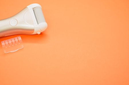 An electric roller file on an orange backgroundの写真素材