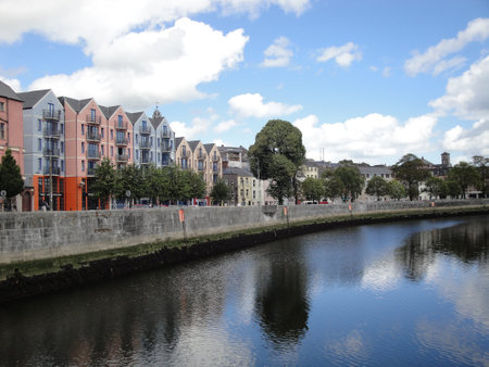 Popes Quay at Lee River, Cork, Ireland. Impressive promenade with colorful house facades,の写真素材
