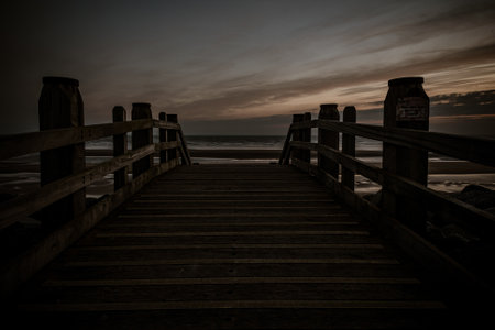 An amazing view of the sea captured from wooden deckの写真素材