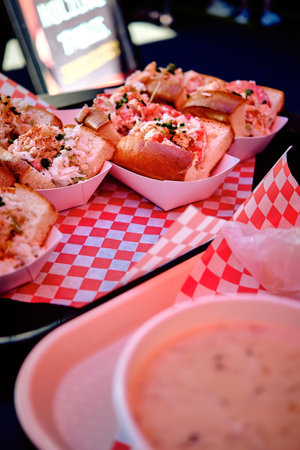 A vertical shot of lobster sandwiches on a tableの写真素材