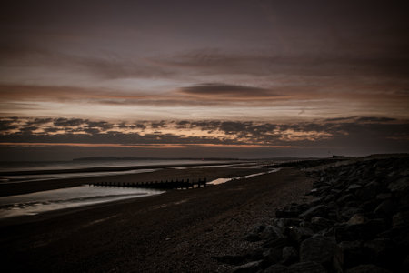 An amazing view of the sea captured from the pebble beach in the eveningの写真素材