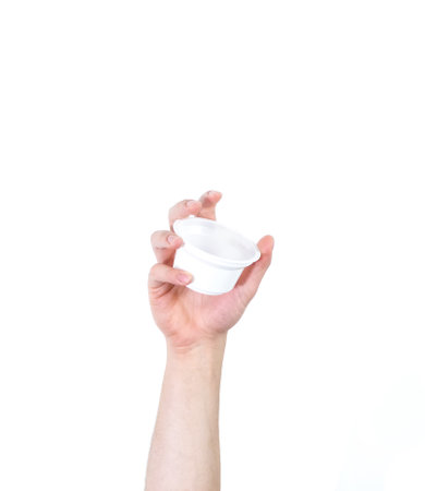 A man's arm raised holding a plastic container isolated on a white background - recycling conceptの写真素材