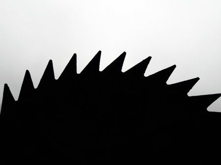 A silhouette of a circular saw bladeの写真素材