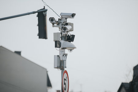 A shallow focus shot of multi-angle traffic cameras on the street poleの写真素材