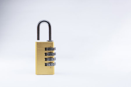 A closeup shot of a combination padlock with a safety code on a white background - copy spaceの写真素材