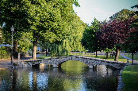 a beautiful shot of a stone bridge over a river in Mikhailovskiy Garden Saint Peterburgの写真素材