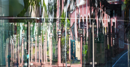 A glass window with outdoor buildings reflection
