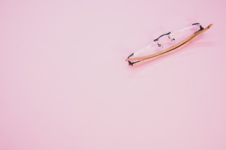 A top view of glasses on a pink background with space for textの写真素材