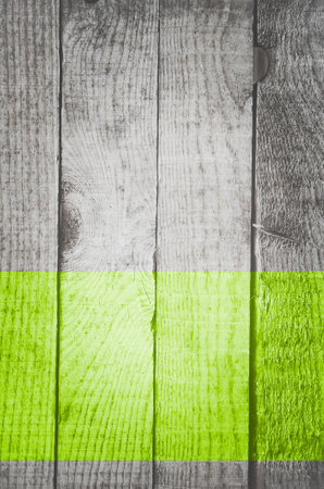 A vertical shot of wooden planks with green paintの写真素材