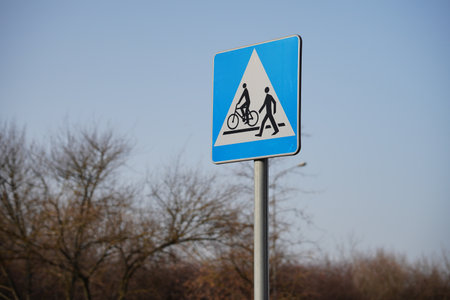A blue street sign for bikers and pedestriansの写真素材