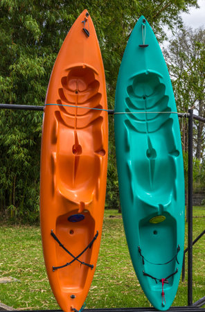A vertical shot of kayaks in a backyardの写真素材