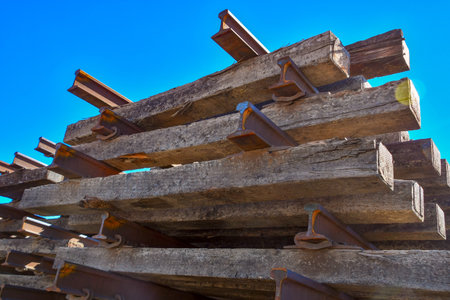 A stack of railroad ties and rail track sitting in a switching yard in El Paso, Texasの写真素材