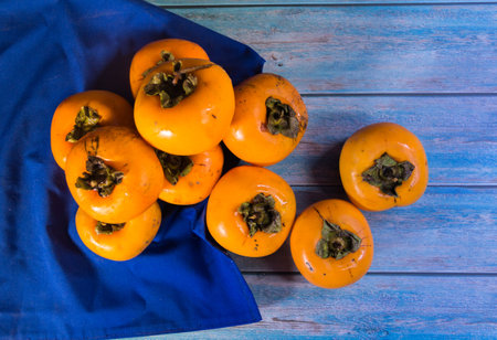 organic and fresh persimmon fruits to prepare jamsの写真素材