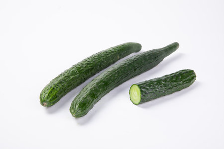 A closeup shot of cucumbers isolated on white backgroundの写真素材