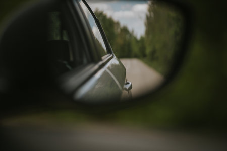 A closeup shot of a car side-view mirrorの写真素材