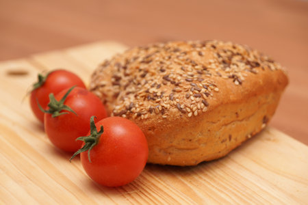 Bread and tomatoes on a wooden board
