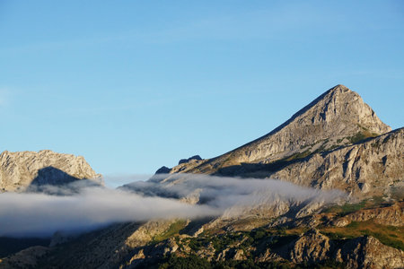 A scenic view of a mountainous landscape in Riano, Leon Spain on a blue sky backgroundの写真素材