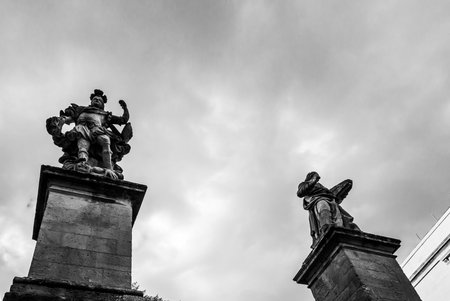 A low angle monochrome shot of beautiful baroque sculptures in Ragusa Province, Italyの写真素材