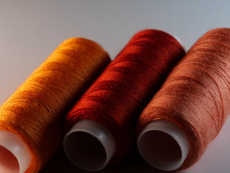 A closeup shot of colorful sewing threads
