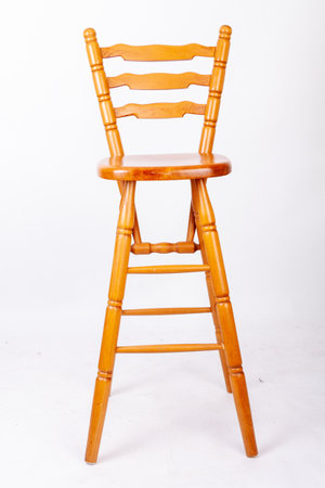 A wooden bar stool isolated on a white background