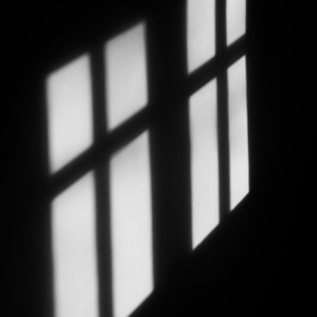 A closeup of a shadow of window on the wallの写真素材