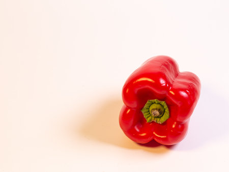 One sweet red pepper isolated on a white backgroundの写真素材