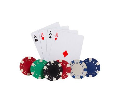 A closeup shot of four aces playing cards and poker chips isolated on white background