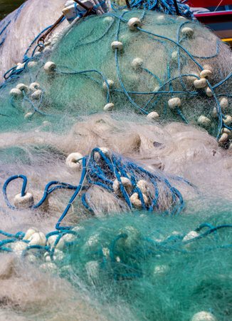 A vertical shot of the details of a fishing netの写真素材