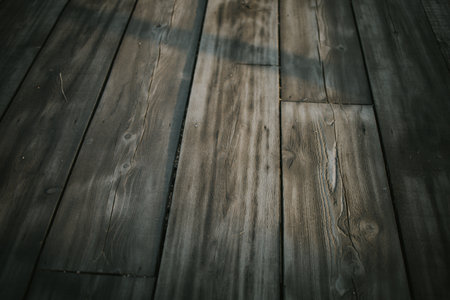 A closeup of a wooden floor - dark wooden planks backgroundの写真素材