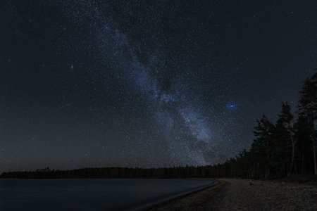 An amazing view of the starry sky and the Milky Way over the lake at night