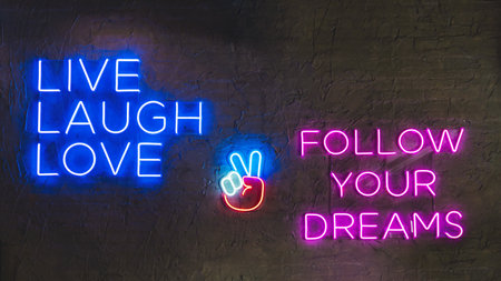A neon glowing light on a wall with '' Live, Laugh, Love'' and ''Follow Your Dreams'' messages