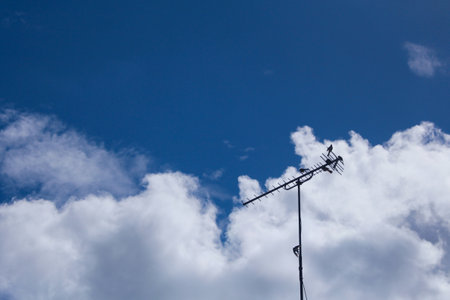 A view of a digital TV antenna in the background of the cloudy skyの写真素材
