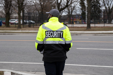 A closeup shot of a security guard watching the parking areaの写真素材