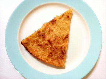A portion of faina, thin genoese pizza made from chickpea flour and olive oil, popular in Argentina...