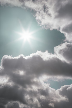 A beautiful view of bright sun shines through clouds