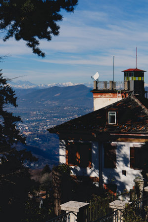 A beautiful shot of a house in Como city with the Alps in the backgroundの写真素材