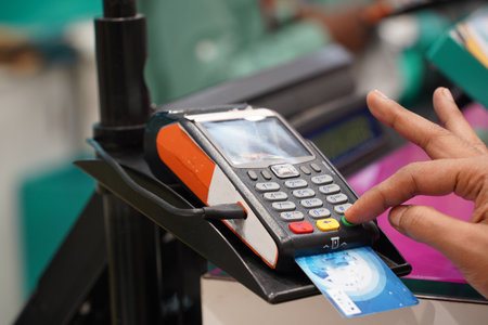 A customer entering security code on credit card reader machine, shopping, credit, debit card...
