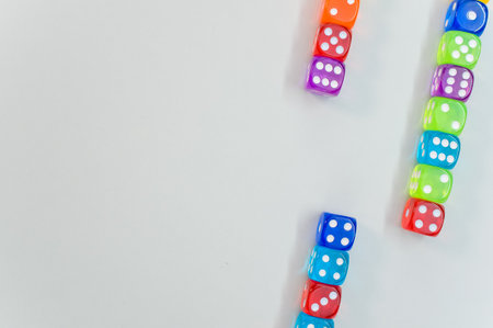 A top view of colorful transparent dice on white background with a copy spaceの写真素材