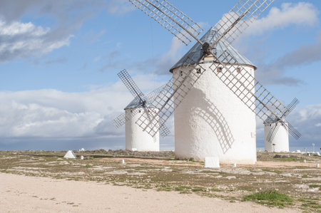 The beautiful windmills captured on a sunny day in Castilla la Mancha, Spainの写真素材