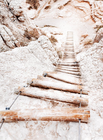 A vertical shot of Hike the Notch Trail Stairway in South Dakota Badlandsの写真素材